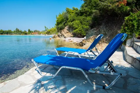 Elegant Villa Beach Front 10 meters from your doorstep, 5 bedrooms in Halkidiki exclusive for sale For Super Rich