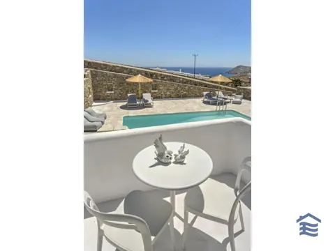 Premium Hotel Panoramic View communal swimming with pool bar, 19 bedrooms in Mykonos property for sale For Super Rich