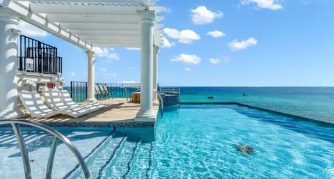Luxury Villa Beach Front Caribbean Sea views, 5 bedrooms in Seven Mile Beach search for sale For Super Rich Luxury Villa Beach Front Caribbean Sea views, 5 bedrooms in Seven Mile Beach search for sale For Super Rich