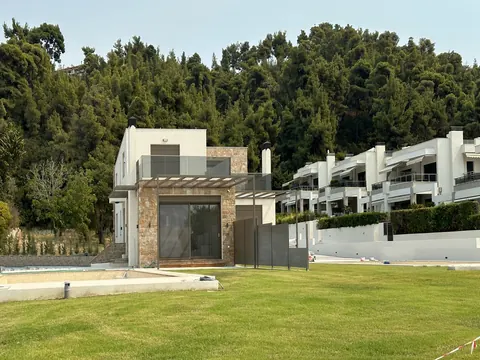 Modern Villa Beach Front 10 meters from the crystal-clear waters of the Aegean Sea, 5 bedrooms in Halkidiki New for sale For Super Rich