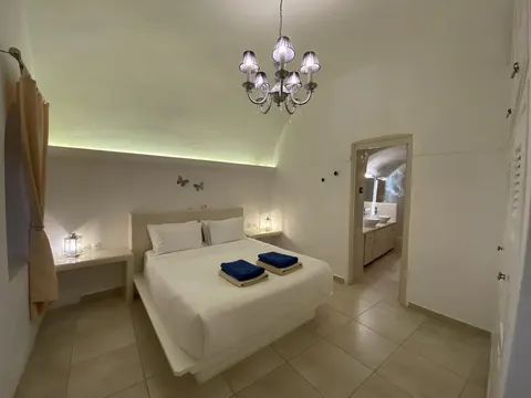 Luxury Villa Panoramic view of Caldera and the Aegean Sea 70m2 terrace with Jacuzzi, 3 bedrooms in Santorini price for sale For Super Rich