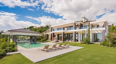 Architectural Villa 72 sqm infinity pool gated community of "La Reserva del Alcuzcuz", 9 bedrooms in Los Arqueros - Benahavis - Marbella available for sale For Super Rich