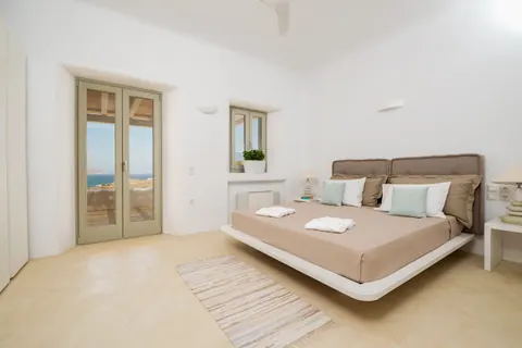 Luxury Villa Mariposa panoramic views of Aegean blue, 8 bedrooms in Mykonos real estate for sale For Super Rich