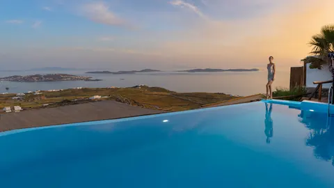 Premium Hotel Panoramic sea view overlooking the Aegean, Tennis court, 29 bedrooms in Mykonos photo for sale For Super Rich